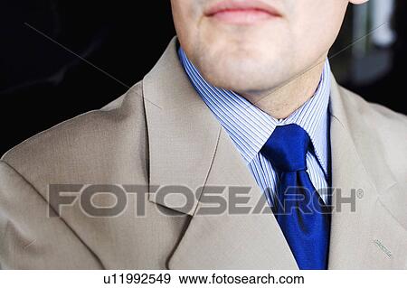Stock Photo -  business closeup 30-34 years suit color image. Fotosearch