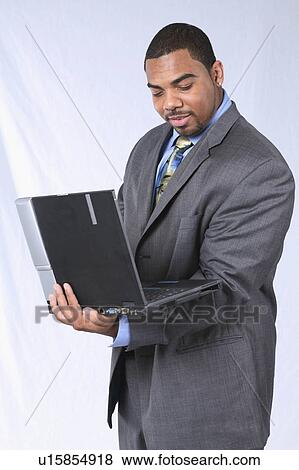 Stock Photo -  business computer people man person face laptop. Fotosearch