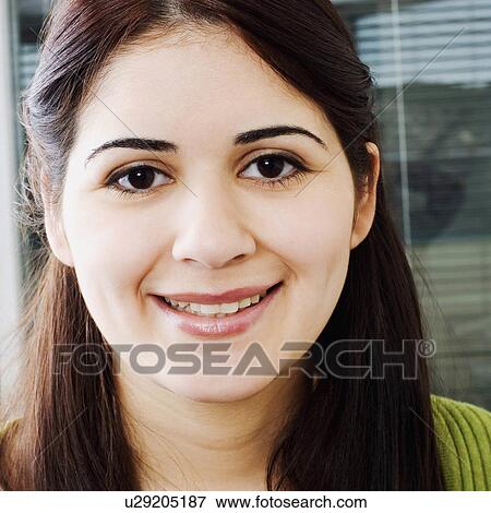 Stock Photo -  business face portrait smiling 25-29 years brown. Fotosearch