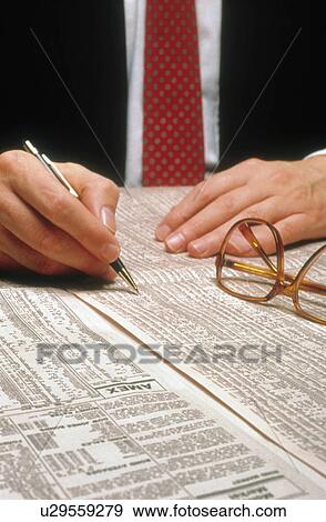 business hand man person scans stock listings 1 View Large Photo Image Stock Photo - business hand man person scans stock listings 1. Fotosearch