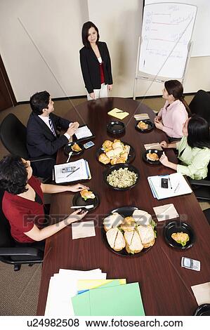 Stock Photo -  business high angle view executives conference. Fotosearch