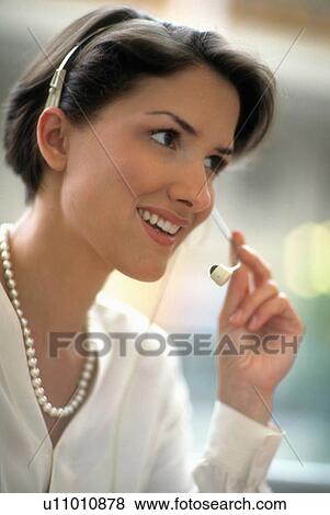 Stock Photo -  business woman office person in uses telephone . Fotosearch
