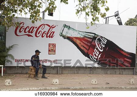 Picture -  cambodia street scene coca cola phnom penh asia. Fotosearch