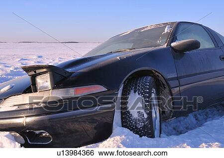 Stock Photograph -  car winter image in ditch snow covered road. Fotosearch