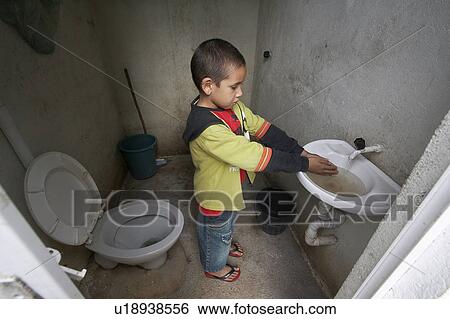 Stock Photograph -  child children brazil boy washing hands in new . Fotosearch
