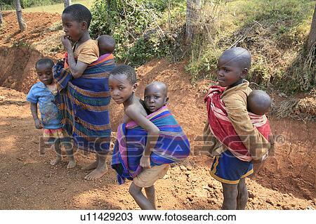 Stock Image -  child children burundi small carrying even sub burundi . Fotosearch
