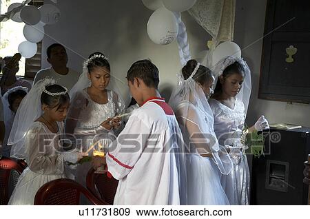 Stock Photo -  child children guatemala catholic first mass . Fotosearch