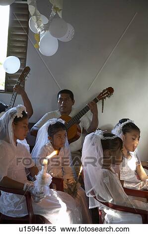 Stock Photography -  child children guatemala catholic first mass. Fotosearch