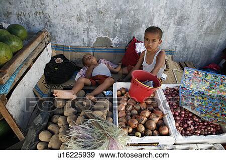 Stock Photo -  child children indonesia hoddi market trader . Fotosearch