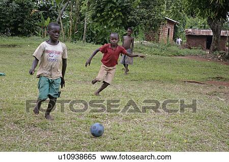 Stock Photography -  child children uganda boys playing footbal use . Fotosearch