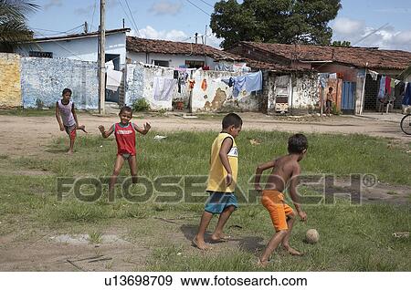 Stock Photo -  child football children brazil favela balcao . Fotosearch