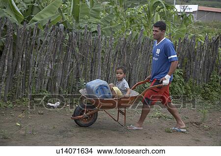 child man children brazil carrying boy in novo View Large Photo Image Picture - child man children brazil carrying boy in novo . Fotosearch