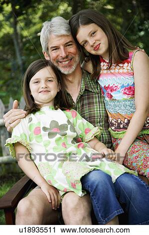 Stock Image -  child man portrait mature sitting smiling two. Fotosearch