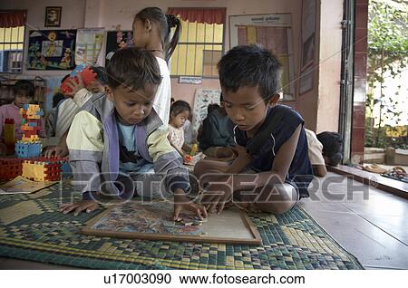 Stock Image -  child school children cambodia asia se play . Fotosearch