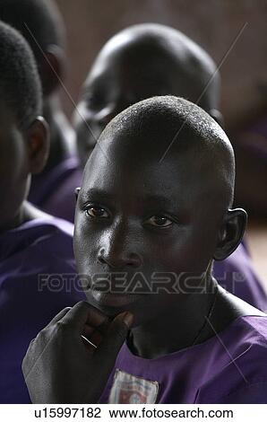Stock Image -  child school face children uganda kyayaaye roman . Fotosearch