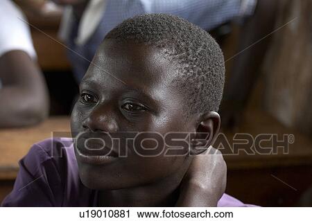 Stock Image -  child school face children uganda kyayaaye roman . Fotosearch
