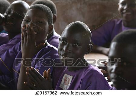 Stock Image -  child school face children uganda kyayaaye roman . Fotosearch
