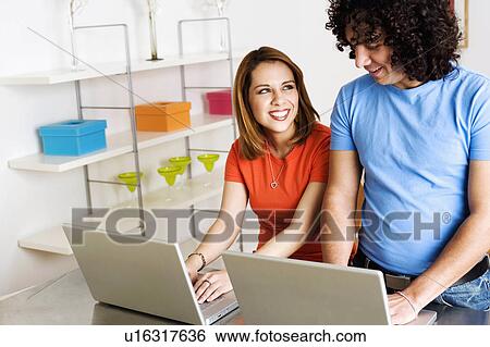 computer couple laptop young laptops smiling View Large Photo Image Stock Photograph - computer couple laptop young laptops smiling. Fotosearch