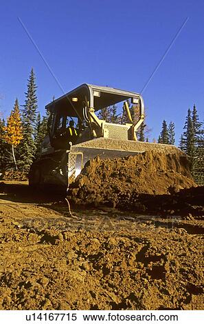 construction large bull dozer pushes mound earth View Large Photo Image Stock Photography - construction large bull dozer pushes mound earth. Fotosearch