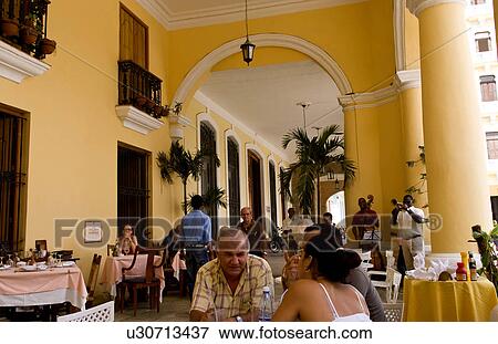 Stock Photo -  couple angel havana capitol city cuba in bar. Fotosearch