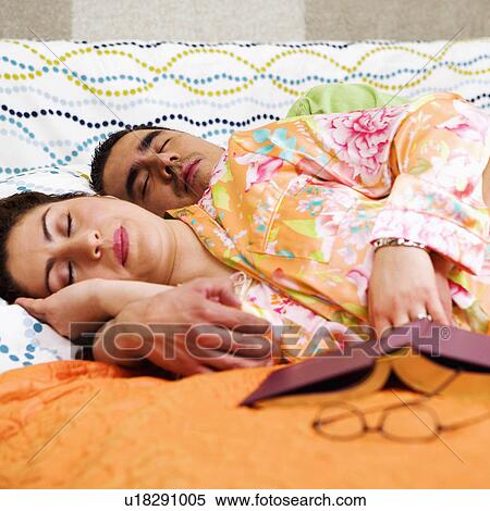couple pattern floral book sleeping bed 30-34 arm View Large Photo Image Stock Photography - couple pattern floral book sleeping bed 30-34 arm. Fotosearch