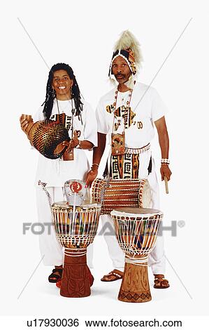 Stock Photograph -  couple portrait mid adult playing musical 30-34. Fotosearch