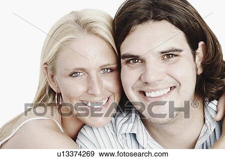 Stock Photo -  couple portrait young smiling 20-24 years 25-29. Fotosearch