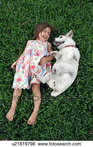 dog girl child person playing in grass 1 animal View Large Photo Image Stock Photo - dog girl child person playing in grass 1 animal. Fotosearch