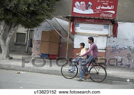 egypt boys riding bicycle port said north africa View Large Photo Image Stock Image - egypt boys riding bicycle port said north africa. Fotosearch