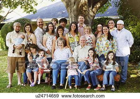 Stock Photo -  family baby child portrait in lawn arm around. Fotosearch