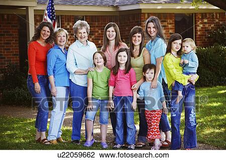 Stock Image -  family house portrait standing in front . Fotosearch