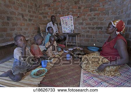 Stock Image -  family woman home uganda in najjemba teopista . Fotosearch