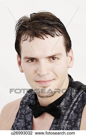 Stock Image -  fashion man portrait young wearing bow tie 25-29. Fotosearch