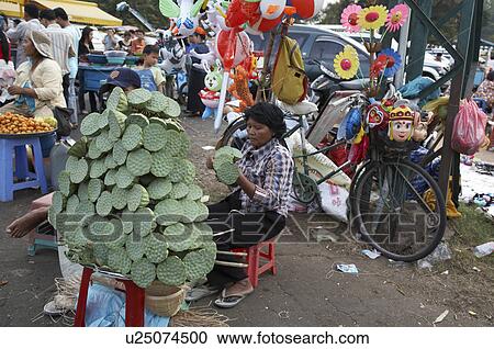 flower woman cambodia selling lotus pods in penh View Large Photo Image Stock Image - flower woman cambodia selling lotus pods in penh . Fotosearch