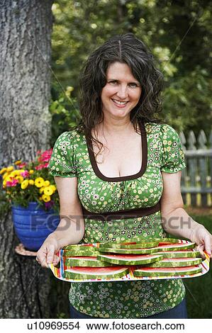 flower woman food portrait mature holding tray View Large Photo Image Picture - flower woman food portrait mature holding tray. Fotosearch