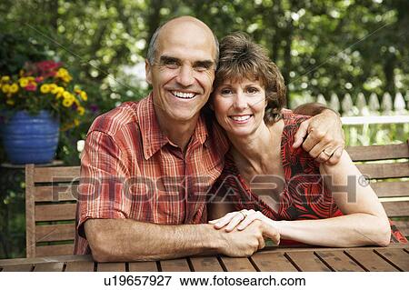 flower woman man mature arm around smiling 45-49 View Large Photo Image Stock Photo - flower woman man mature arm around smiling 45-49. Fotosearch