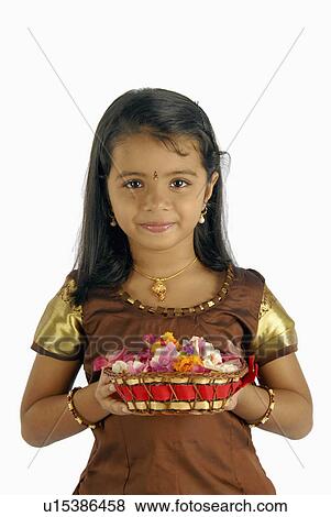 Stock Photo -  flowers girl child model kerala in attire onam. Fotosearch