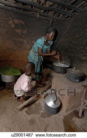 food child children uganda wood burning cooking View Large Photo Image Stock Photo - food child children uganda wood burning cooking . Fotosearch