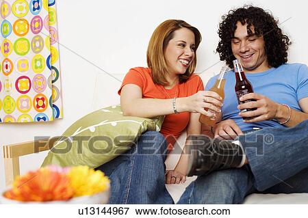 food couple young holding bottles cold drinks View Large Photo Image Stock Photo - food couple young holding bottles cold drinks. Fotosearch