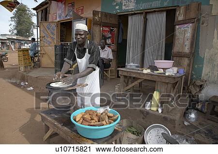 Stock Image -  food man uganda making chapattis nakifuma mukono . Fotosearch