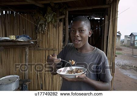 food man uganda young eating breakfast village View Large Photo Image Stock Image - food man uganda young eating breakfast village . Fotosearch