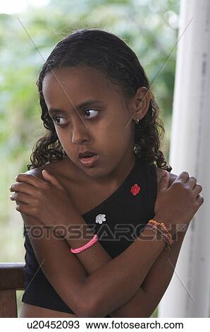 Stock Image -  girl child face children brazil organic garden . Fotosearch