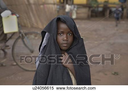 Stock Photography -  girl child face children uganda wearing mans . Fotosearch