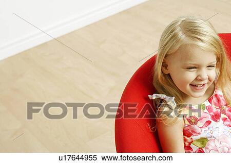 Stock Photography -  girl child high angle view sitting smiling 4-5 years. Fotosearch