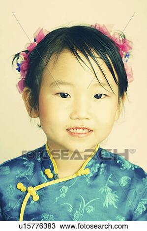 Stock Image -  girl child pattern floral portrait in clothing. Fotosearch