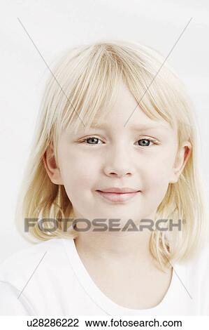 Stock Image -  girl child portrait smiling 6-7 years blond hair. Fotosearch