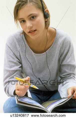 Stock Photo -  girl person headphones studying 13-15 years. Fotosearch