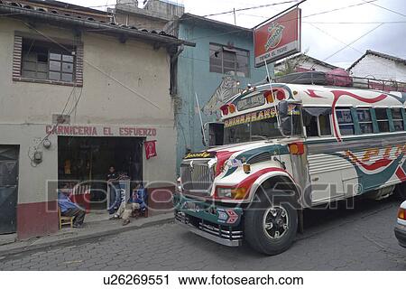 Stock Image -  guatemala chicken bus rolling townn central bus. Fotosearch