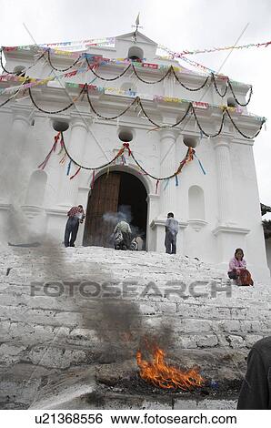 Stock Photograph -  guatemala church el quiche ceremonial flames . Fotosearch