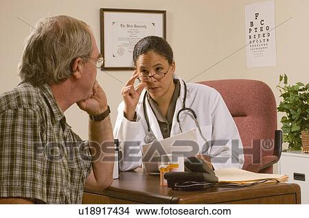 hand doctor female african american male patient View Large Photo Image Picture - hand doctor female african american male patient. Fotosearch